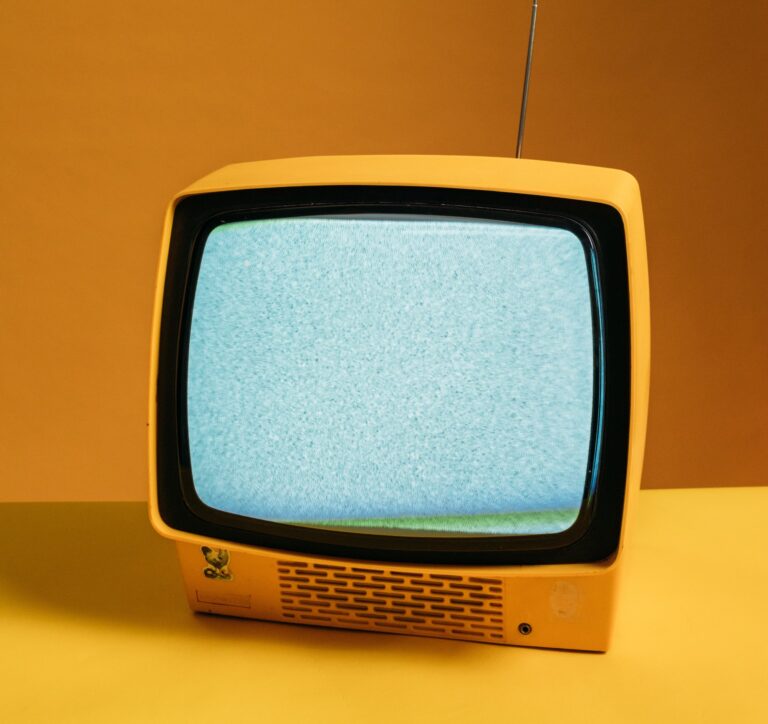 classic yellow tv with blank static screen